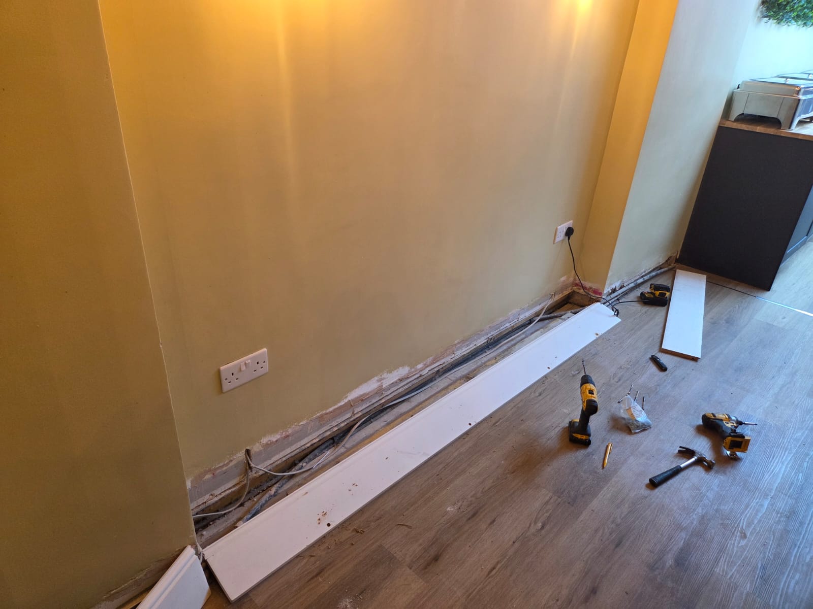 Bare plaster wall before decorative woodwork trimming installation