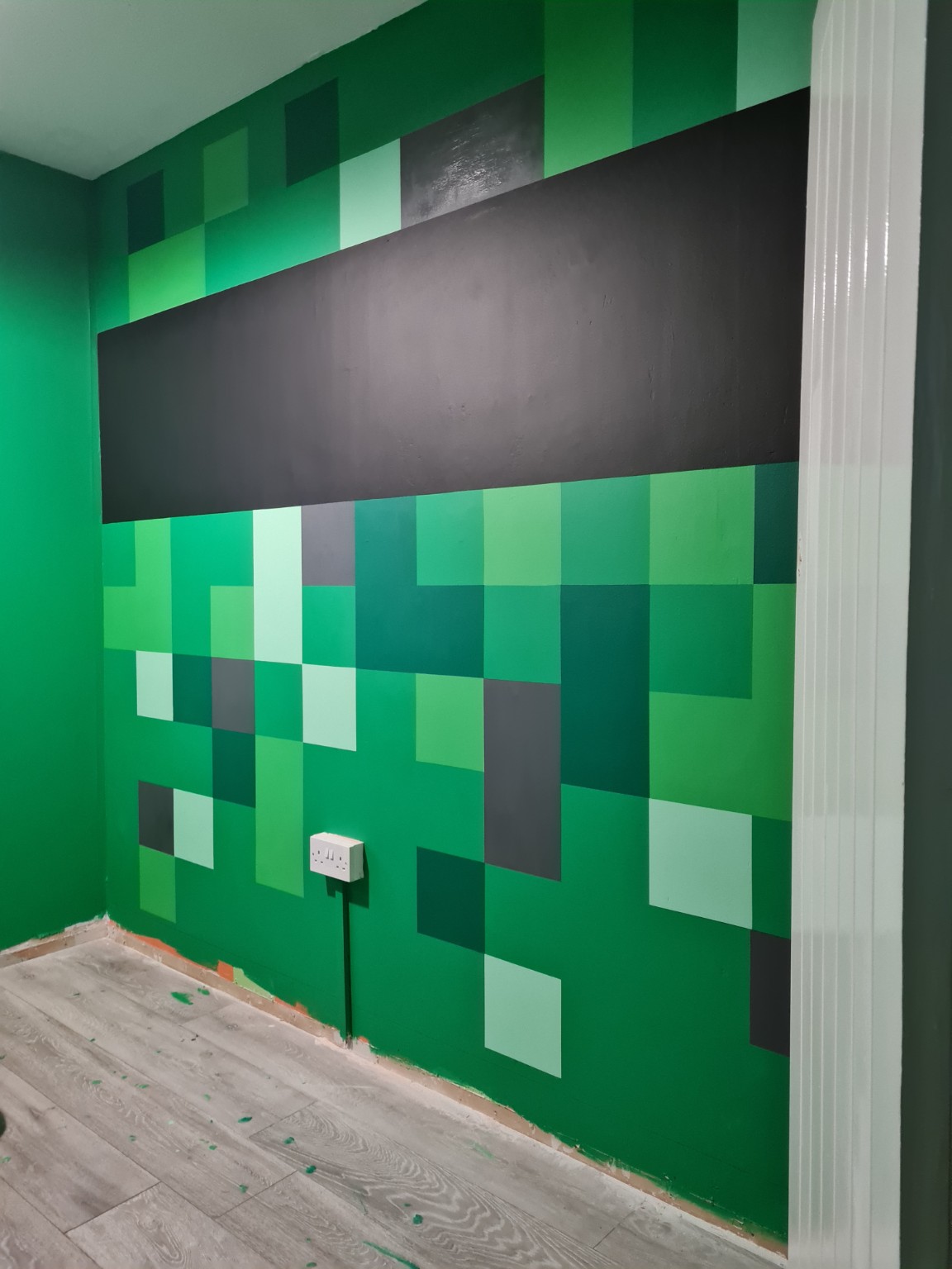 Bespoke TV feature wall setup before framing in Swindon